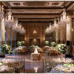 Wedding Reception with whites and greens in tall and low centerpieces