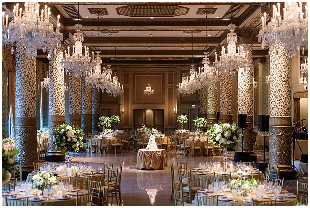 Wedding Reception with whites and greens in tall and low centerpieces